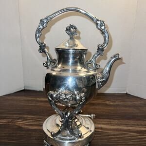 vintage Sheridan silverplate tilting teapot with an ornate stand and burner